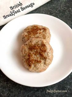 two sausage patties on a white plate next to a bag of british breakfast sausage