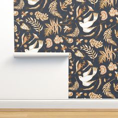 the wall paper is designed with birds and flowers in gold, black, and white