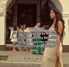 a woman is walking down the street with her hand on her hip and texting it's a luxury to talk to me it's a luxury to have my time