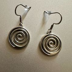 Swirl Spiraling Earring Silver Brand New For Girls Women Boy Men Men’s Women’s Unisex Silver Tone Spiral Earrings. *Brand New. *Silver Tone. *Earrings Size: 3cm/1.5 Inches Approximately. *Material: Stainless Steel And Aluminum Alloy. *Occasion: Casual, Formal, Going Out, Work, School, Gifting, Etc. *Style: Goth Grunge Aesthetic Vintage Y2k 2000s Emo Punk 90’s. Will Ship Next Day Or Same Day If Possible. Tags: #Y2k #Vintage #Earrings #Coquette #Swirl Pendant Balletcore Indie Grunge Streetwear Pre Dark Silver Earrings, 90s Jewellery, Emo Piercings, Goth Grunge Aesthetic, Indie Earrings, Necklace Coquette, 90s Earrings, Grunge Earrings, Streetwear Preppy