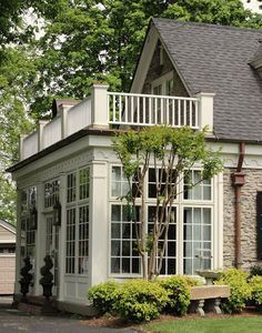 a house with white trim and large windows