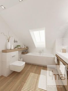 a white bathroom with wooden flooring and skylights above the bathtub is shown