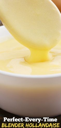 a spoon is being used to dip cheese into a bowl with the words perfect - every - time blender hollandaise