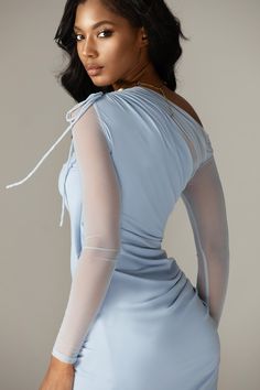 Its from our lightweight organza mesh fabric, blended with the purest, most luxurious mulberry silk in a pretty pastel blue hue. 'Dua’ is one of the highlights of our new season collection. Featuring an off shoulder neckline with pretty adjustable shoulder that create a beautiful shape around the neck and ruched effect gently down through the bust. The delicate gathering throughout flatters your figure and the sleeves fit slim through the arms. The close fit is enhanced by the special soft inner Elegant Blue Mesh Dress For Summer, Elegant Blue Mesh Summer Dress, Chic Blue Mesh Dress For Spring, Elegant Blue Mesh Dress For Spring, Blue Fitted Mesh Dress For Spring, Fitted Blue Mesh Dress For Spring, Chic Blue Mesh Dress For Evening, Elegant Blue Mesh Dress For Party, Spring Evening Ruched Mesh Dress