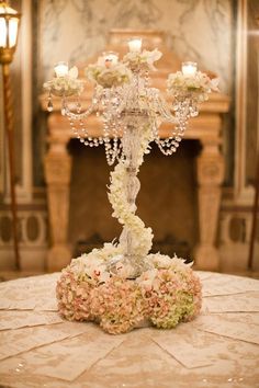 the wedding cake is decorated with flowers and candles