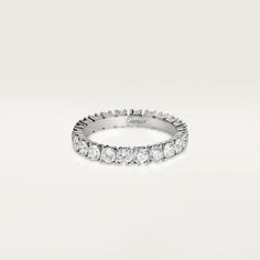 a white gold wedding band with round diamonds