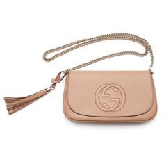 This beautiful embossed camelia beige crossbody is the perfect bag for any everyday look or dressed up for a night out. The color makes it easy to match everything in your wardrobe and the classic embossed Gucci logo makes it a complete classic piece for any handbag collection. The detachable leather tassel is a perfect fun touch to this bag. Though lightweight and its small appearance, this bag is large enough to easily carry all of your essentials.    Model: 536224  Beige Textured Calf Leather   Gold-Tone Hardware  Gucci GG Embossed Logo  Detachable Tassel Accent  Gold Chain Strap  Front Flap Magnetic Snap Closure  Tan Canvas Interior lining  One Interior Zip pocket  One Interior  Slip pocket  Strap Drop: 21.5" inches  Measurements: 11" x 3.5" x 6.75" (LWH)  Includes controllato cards an Chic Gucci Crossbody Shoulder Bag, Gucci Beige Crossbody Bag, Chic Gucci Shoulder Bag In Beige, Chic Gucci Clutch Bag, Chic Beige Gucci Shoulder Bag, Chic Gucci Leather Clutch, Trendy Gucci Shoulder Bag With Detachable Strap, Elegant Gucci Clutch Shoulder Bag, Gucci Chic Evening Clutch