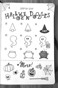 an open notebook with halloween doodles on it