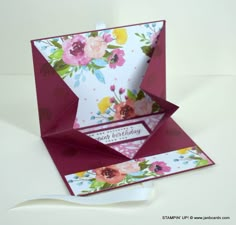 an origami birthday card with flowers on it