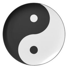 a black and white plate with a yin symbol on it