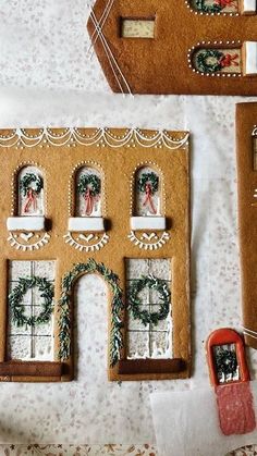 gingerbread house decorated with wreaths and decorations