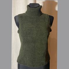 New in good condition. Vintage dark olive very soft vest with turtleneck. Brand: Dresbarn    Size: USA S    Material: 100% acylic Measurements: Lay flat and tied closed Shoulder width; 33 cm, 13 inches Width under the sleeves; 45 cm, 18 inches Length; 55 cm, 22 inches Be careful with measurements, because waist, hip and chest circumference must be multiplied by 2 If you have any questions or need additional pictures, write. We do not accept the product back, so it is imperative to make sure that Fitted Turtleneck Casual Vest, Fitted Turtleneck Vest, Casual Style, Fitted Turtleneck Vest Casual Style, Winter Stretch Turtleneck Tank Top, Green Winter Vest Top, Stretch Turtleneck Tank Top For Winter, Fitted Khaki Vest For Winter, Fitted Green Sweater Vest For Fall, Fall Khaki Vest Top