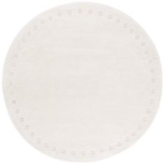 a white round rug with dots on the top and bottom, in front of a white background