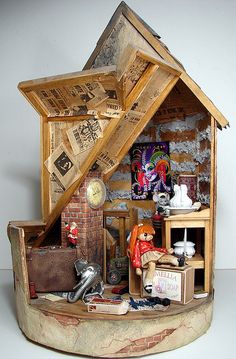 a doll house with furniture and accessories inside