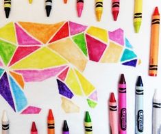 colorful crayons are arranged in the shape of a bear and an animal's head