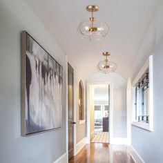 the hallway is clean and ready to be used as an entrance way for someone's home