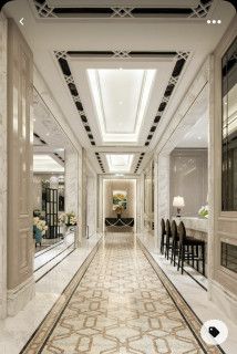 an elegant hallway is shown in white and beige colors with black accents on the ceiling