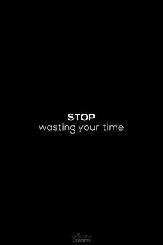 the words stop wasteing your time are written in white on a dark black background