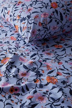 a blue and orange floral print sheet set