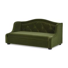 a green couch sitting on top of a white floor