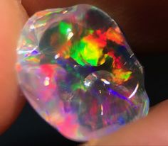 a close up view of an opalese shaped object in someone's hand