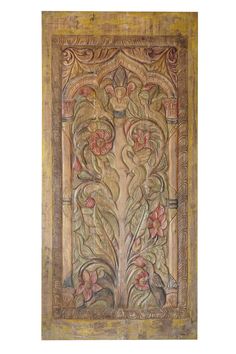 an intricately decorated wooden panel with flowers