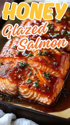 honey glazed salmon on a baking sheet with text overlay that reads honey glazed salmon