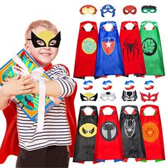 a young boy dressed up as a superhero with his cape and masks on, holding a book