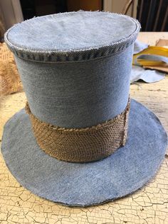 a blue hat sitting on top of a wooden table