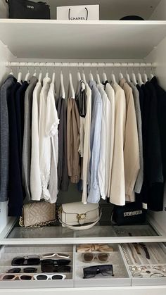 an organized closet with clothes and shoes