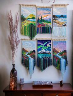 the wall hangings are decorated with colorful art and decorative items, including vases