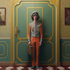 a man standing in front of a green door with an orange suit and hat on