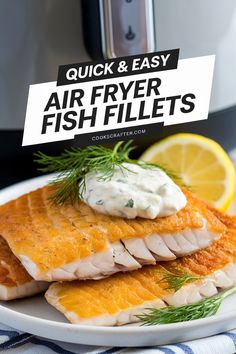 air fryer fish fillets on a plate with lemon wedges and dill