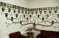 a living room with two couches and a family tree on the wall