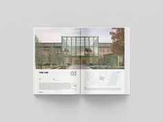 an open book showing the inside pages of a building with glass windows and trees in front of it