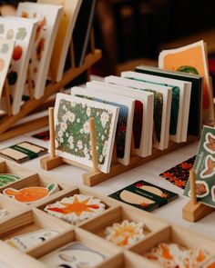 many cards are displayed on wooden stands