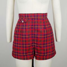 Rare early 1950s Jantzen European fabric plaid cotton shorts ~Red, green, blue, and yellow plaid cotton ~Front button flap lipstick pocket ~Back metal zipper  Hand washed and ready to wear. Condition: Excellent. Wear spot at crotch, faint whitish spot on back and part of zipper has been restitched Size: Marked 10. Fit like a modern XS *please consult measurements to ensure fit Measurements Waist: 25"(top of waistband) / 24.5" (bottom of waistband) Hip: 34.5-35" Rise: 13" Inseam: 2.25" Outseam: 14" Message us with any questions! Sarah Vogt Preppy Fitted Short-length Shorts, Preppy Fitted Shorts With Short Length, Plaid Cotton Shorts For Daywear, Fitted Plaid Cotton Shorts, Plaid High Waist Cotton Shorts, High Waist Plaid Cotton Shorts, Fitted Vintage Plaid Bottoms, Preppy Plaid Short Bottoms, Vintage High Waist Plaid Bottoms