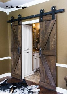 an open barn door with two sliding doors on each side and the words, mullifer designs