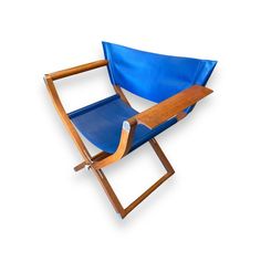 a blue chair with a wooden arm rest