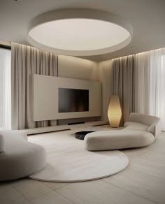 a modern living room with round couches and a flat screen tv