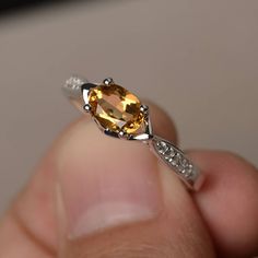 This is a gorgeous handmade creation. Its beauty is its simplicity & Elegance. The 5*7 mm oval shape faceted natural citrine is crafted in solid sterling silver and with rhodium plated. All item is sent in a beautiful gift box If you have any idea of design your ring,pls contact me directly. You can realize more lovely stuff clicking the link https://www.etsy.com/shop/knightjewelry?refshopsection_shophome_leftnav Please leave the correct address and you phone number for delivering successful Oval Citrine Birthstone Ring, Oval Yellow Citrine Birthstone Ring, Amber Birthstone Ring, Oval Citrine Birthstone Ring With Center Stone, Oval Topaz Ring With Citrine Accents, Oval Citrine Birthstone Ring For Anniversary, Oval Amber Topaz Ring, Oval Citrine Topaz Ring In White Gold, Oval Citrine Crystal Ring With Birthstone