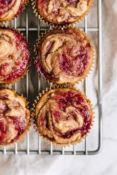 freshly baked strawberry muffins on a cooling rack