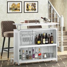 a white bar cart with wine glasses and liquor bottles on it in a living room