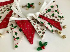 a white and red christmas decoration with bells