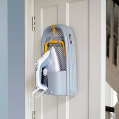 an ironing board attached to a door handle