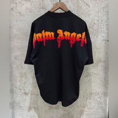 Palm Angels T Shirt New With Tags Logo Tops For Streetwear With Short Sleeves, Logo Short Sleeve Tops For Streetwear, Short Sleeve Logo Tops For Streetwear, Short Sleeve Tops For Streetwear, Oversized Black Logo Top, Oversized Black T-shirt With Logo, Black Logo Top With Short Sleeves, Black Short Sleeve Tops With Logo, Black Relaxed Fit Tops With Logo