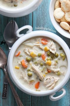 two bowls of chicken pot pie soup with crackers