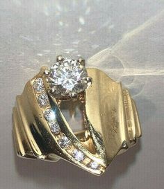 a gold ring with a diamond in the middle