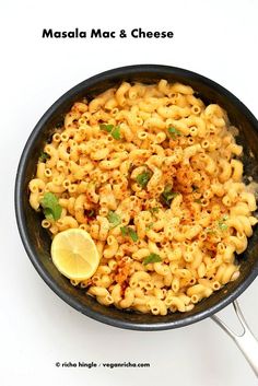 a skillet filled with macaroni and cheese, garnished with parsley