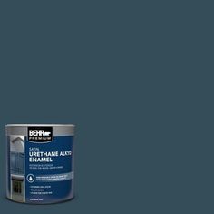 a can of behr paint on a grey background